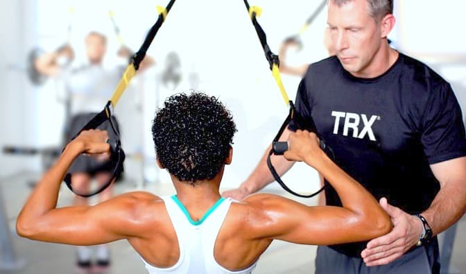 https://blogs.stringssg.com/wp-content/uploads/2018/09/TRX-trainer-guiding-Pic4.jpg