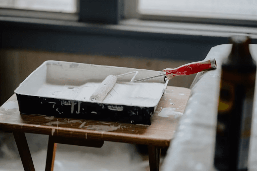 paint roller in a paint tray