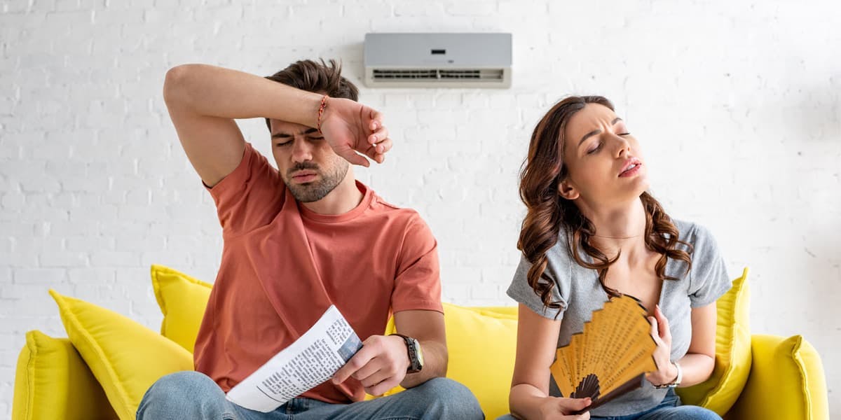 young couple thinking of aircon repair