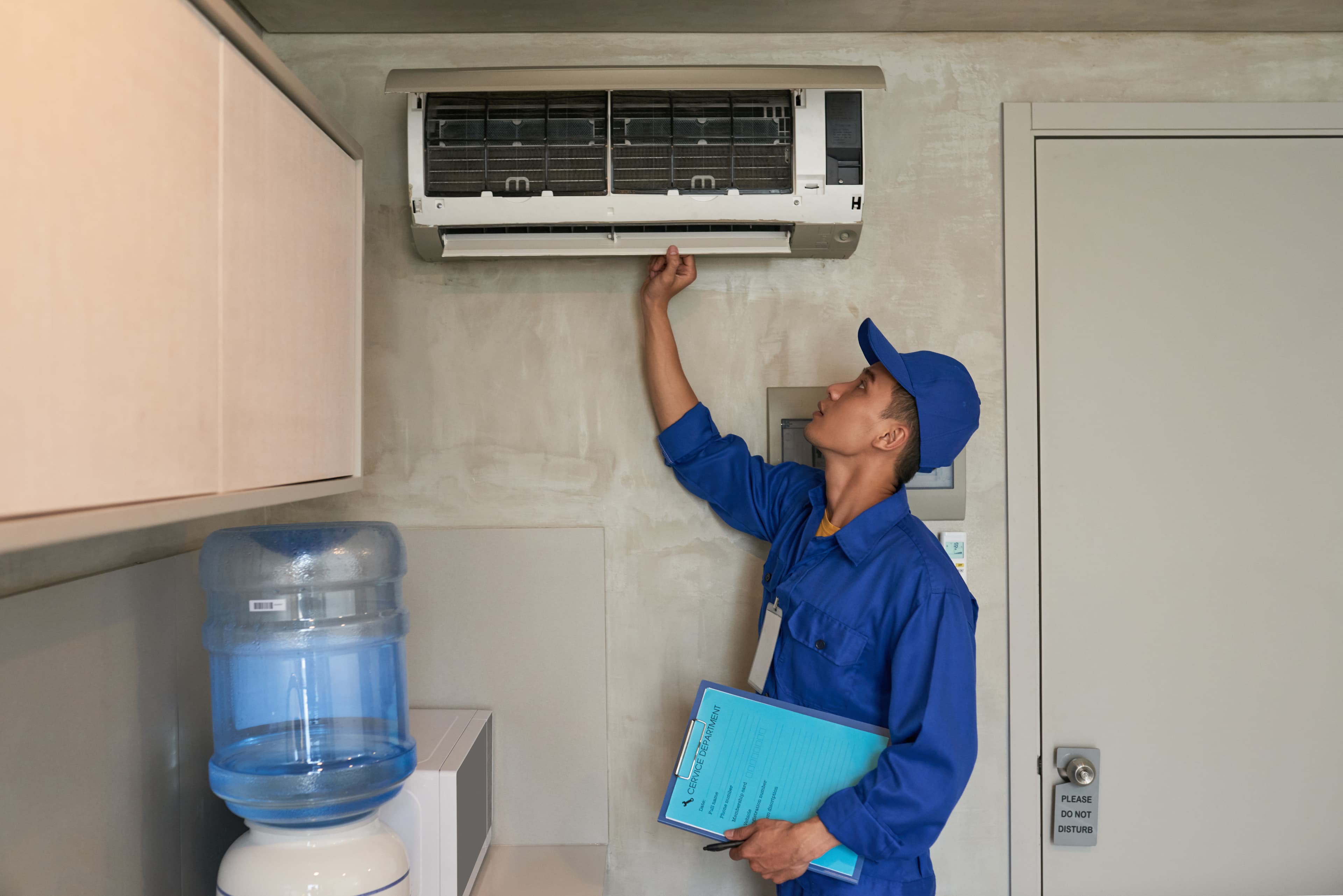 Technician checking the aircon blower